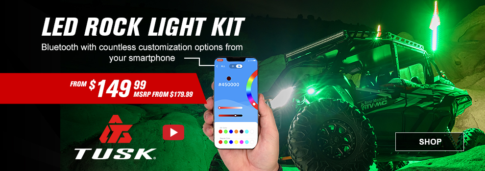 Tusk LED Rock Light Kit, Bluetooth with countless customization options from your smartphone, From $149 and 99 cents, MSRP from $179 and 99 cents, Video available, callout,  a hand holding a smartphone showing the screen along with an image of a Kawasaki KRX 1000 in the background with the lights on in green, link, shop