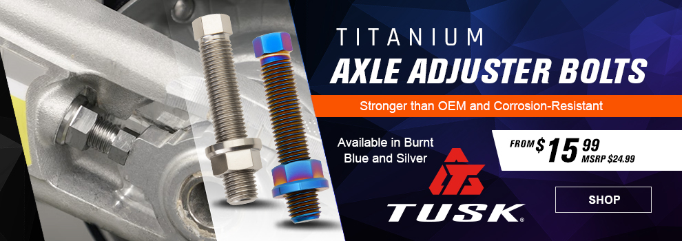 Tusk Titanium Axle Adjuster Bolts, Stronger than OEM and Corrosion-Resistant, From $15 and 99 cents, MSRP $24 and 99 cents, the silver adjuster bolt in the swingarm of a dirt bike, a closeup of both the silver and burnt blue axle bolts, link, shop