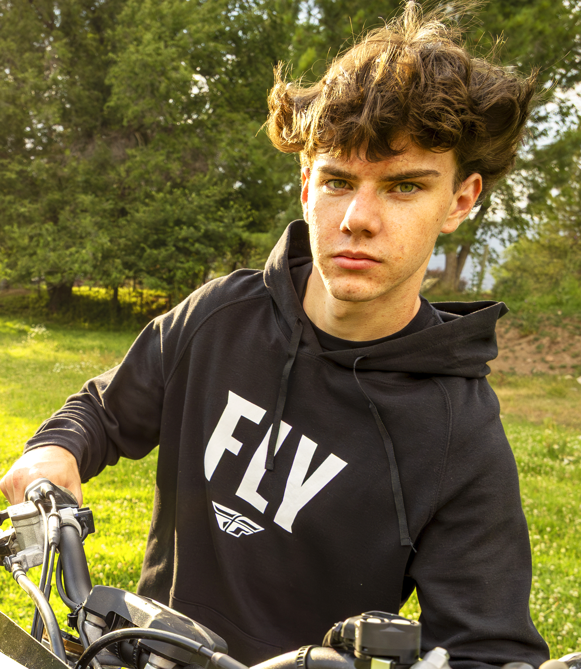 Man wearing a Fly Racing hoodie