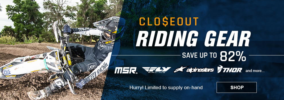 Closeout Riding Gear, Save up to 82 percent, MSR, Fox, Fly Racing, Thor and more, Hurry! Limited to supply on hand, a man sliding around a berm on a dirt bike wearing Fly gear, link, shop