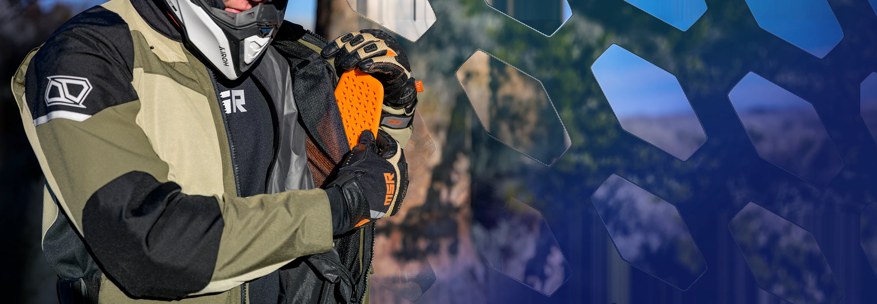 Rider installing removable D3O® armor into the MSR Cryomesh jacket