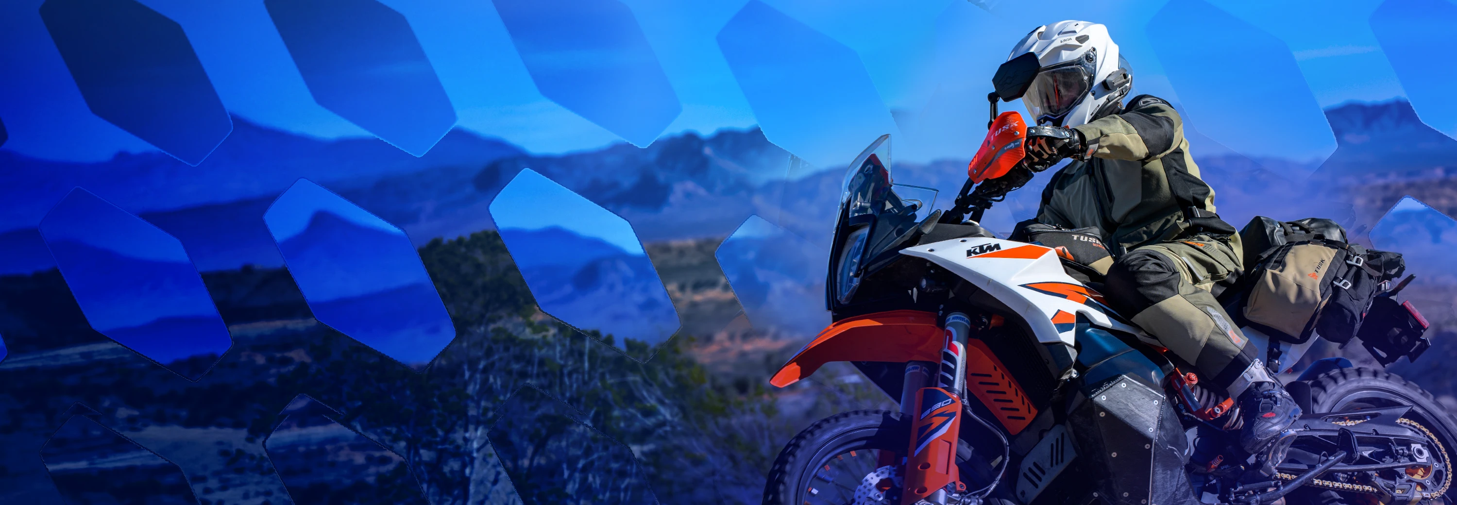 Rider wearing MSR Cryomesh pants with stretch mesh for breathable comfort and mobility on an adventure motorcycle