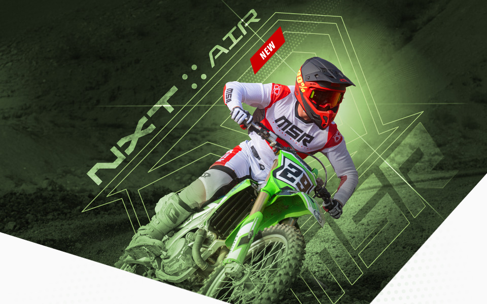 
				
				MSR NXT Air, new, a rider wearing a set of red NXT Air gear turning a corner infront of a background of green with the MSR Icon and lense flare behind.
				
				
				
				