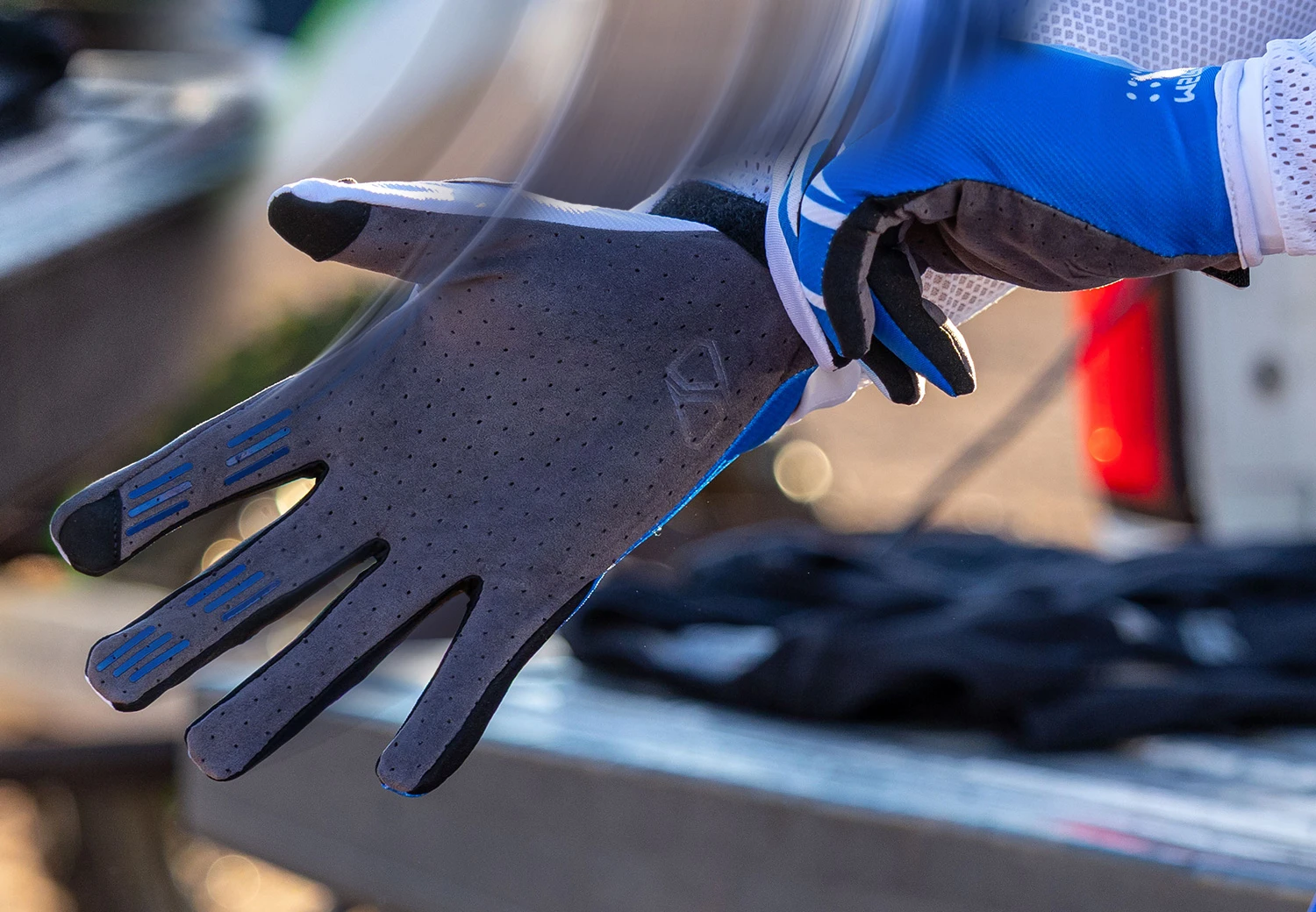 Rider wearing MSR NXT Air gloves highlighting ventilated back of hand design