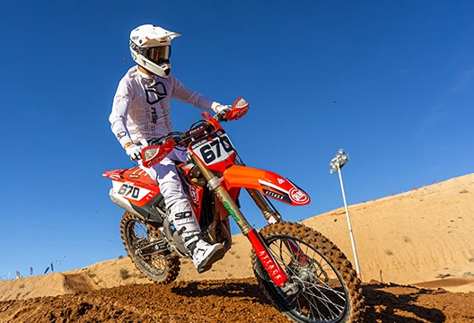 Rider wearing MSR NXT Air gear riding on a dirt track