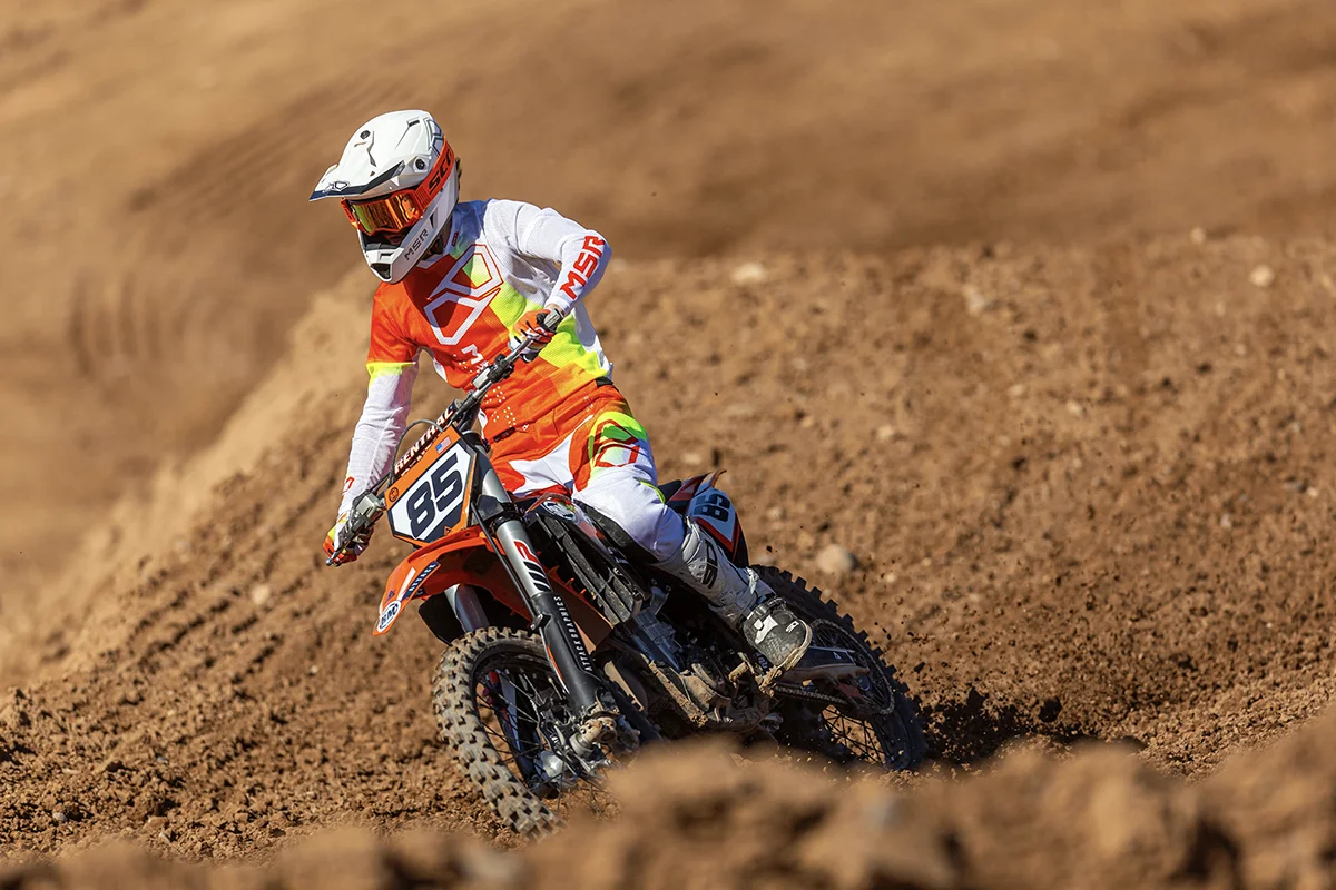 View of rider wearing MSR NXT Air gear on a dirt track