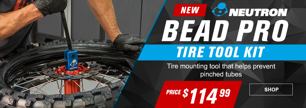 New, Neutron Bead Pro Tire Tool Kit, Tire mounting tool that helps prevent pinched tubes, price $114 and 99 cents, Charles using the tool to mount a dirt bike tire in the shop, link, shop