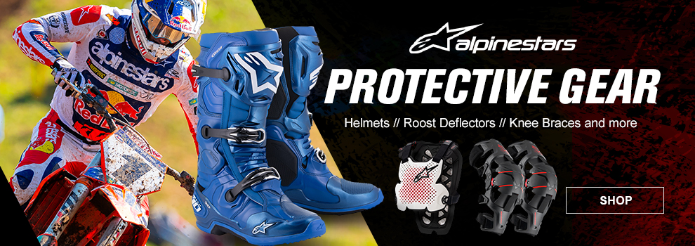 Alpinestars Protective Gear, Helmets, Roost Deflectors, Knee Braces, and more, a pair of blue Tech 10 Boots, a white roost deflector, and a pair of knee braces, along with Chase Sexton riding his KTM in the background, link, shop