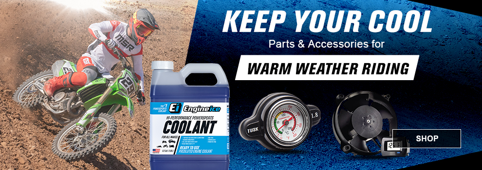 Keep your cool, parts and accessories for warm weather riding, someone riding a Kawasaki dirt bike at an MX track on a hot day, a bottle of Engine Ice, a Tusk radiator cap with temp gauge, and a Trail Tech digital radiator fan, link, shop